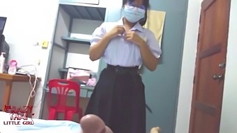 Two Thai Friends Engage In Sexual Activity, Including A Youthful Student Wearing Glasses